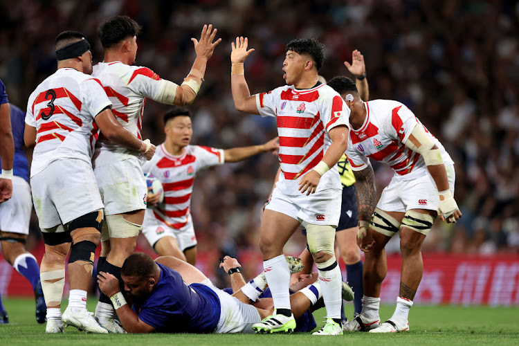 Atsushi Sakate and Kazuki Himeno of Japan celebrate a turnover during the 2023 Rugby World Cup match against Samoa at Stadium de Toulouse on September 28 2023 in France.