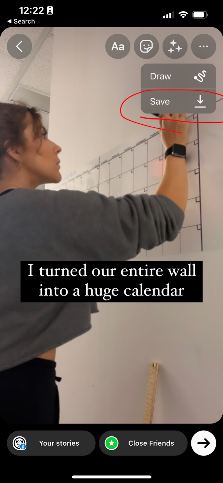 Screenshot of Inspired Idiots Kelsey creating a large wall calendar for the office space, added into Instagram Story editing with text overtop that reads “I turned our entire wall into a huge calendar.” The drop-down “Save” option is circled in red.