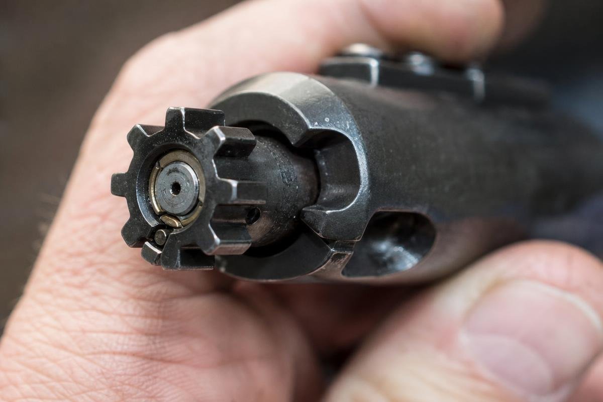AR-15 extractor gripping a cartridge case rim during the firing cycle