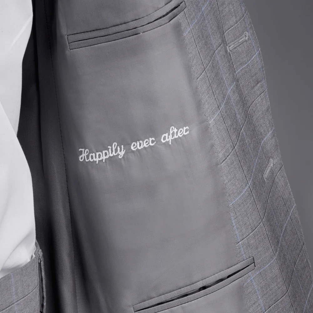 A personalized wedding suit lining showing how custom tailoring can add meaningful details without changing the outside silhouette.