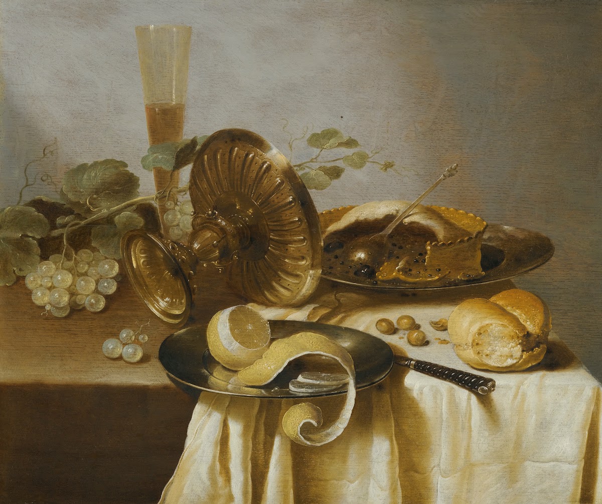 Still Life With A Pie A Half Peeled Lemon Bread Hazelnuts Grapes A Glass And An
