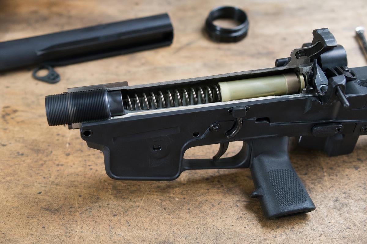 AR-15 mil spec buffer tube installed in lower receiver showing buffer and spring