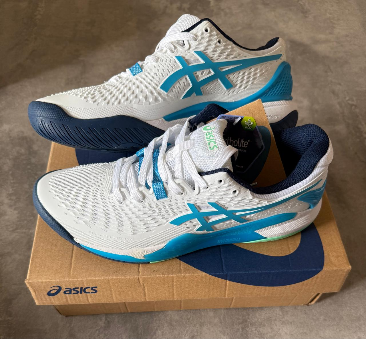 ASICS RESOLUTION 9 BLANCA CON CELESTE Y AZUL