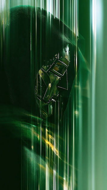 Doctor Doom wearing a metal mask and green hooded cloak behind vertical streaks of green light.