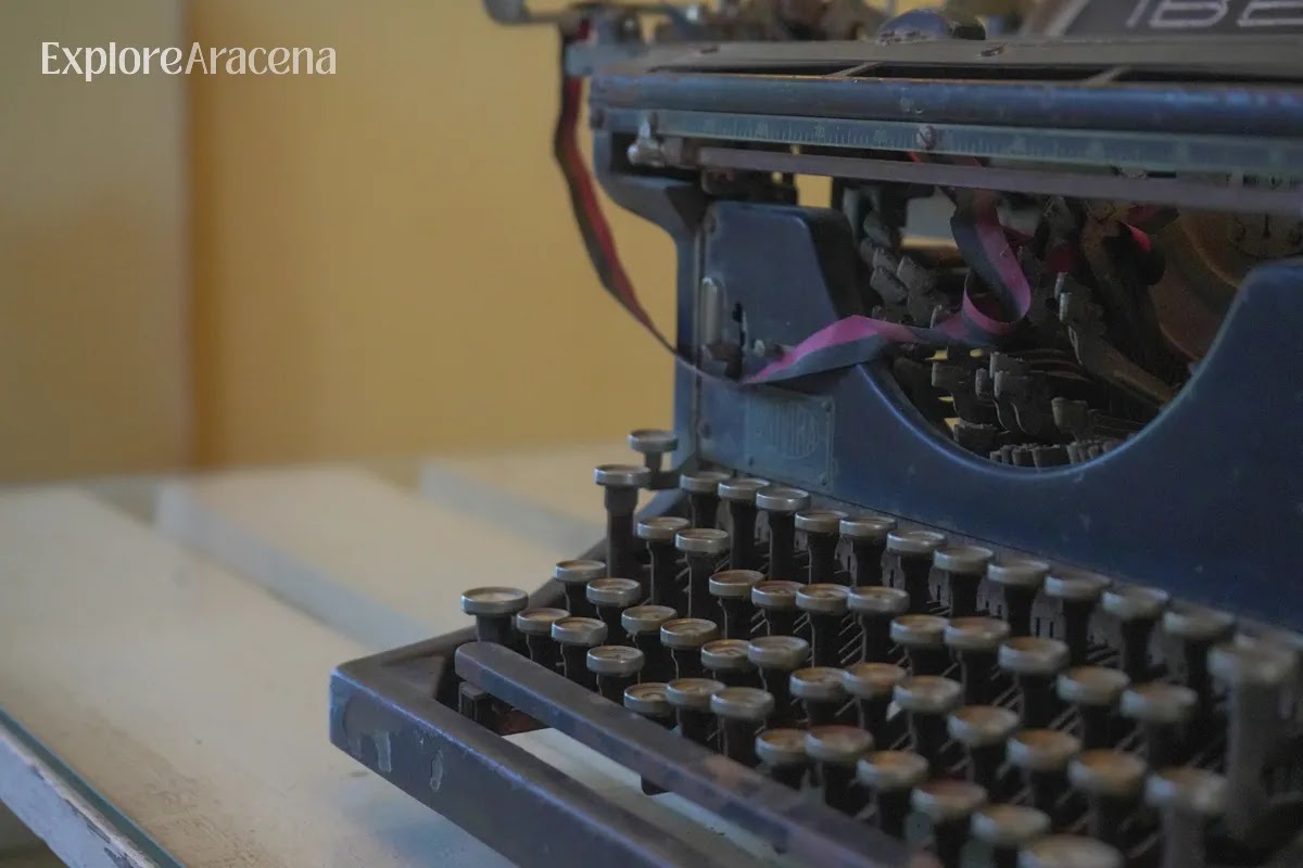 Vintage typewriter displayed among the historical artefacts inside the Martes Santos distillery museum.