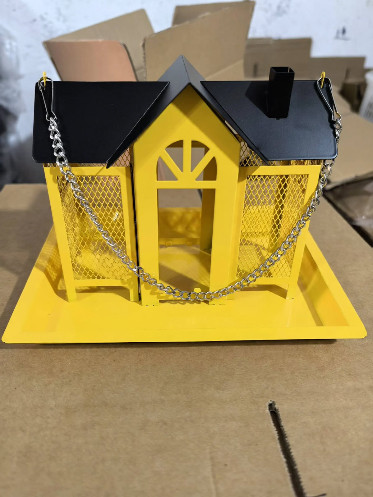 Hanging bird feeder in house shape with chain