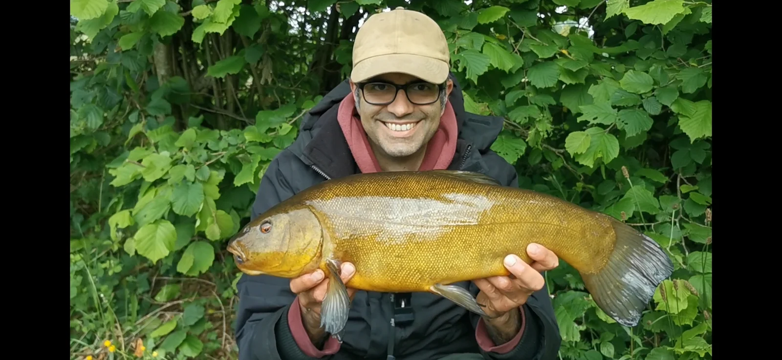 Dan Frazer with a Tench caught on sweetcorn at a club water