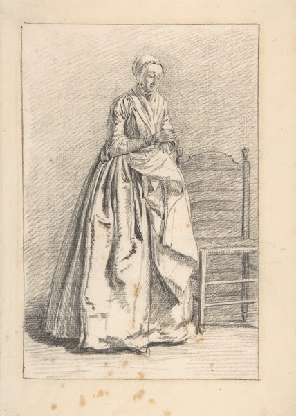 A Woman Standing next to a Chair