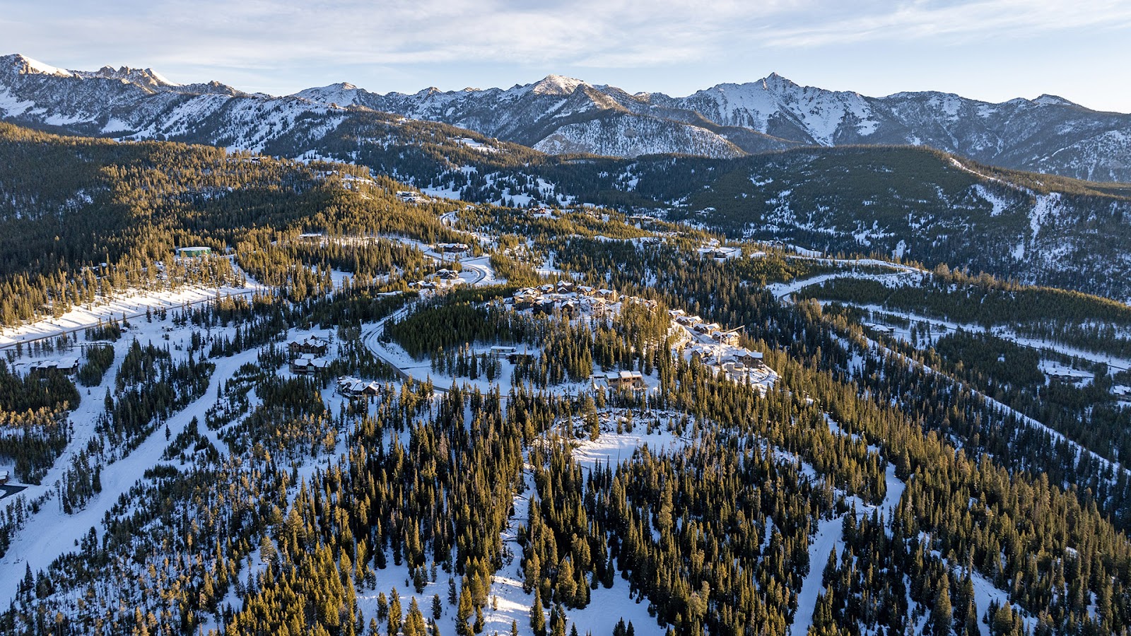 Cascade Ridge condos in the Big Sky Mountain Village with Lone Peak beyond