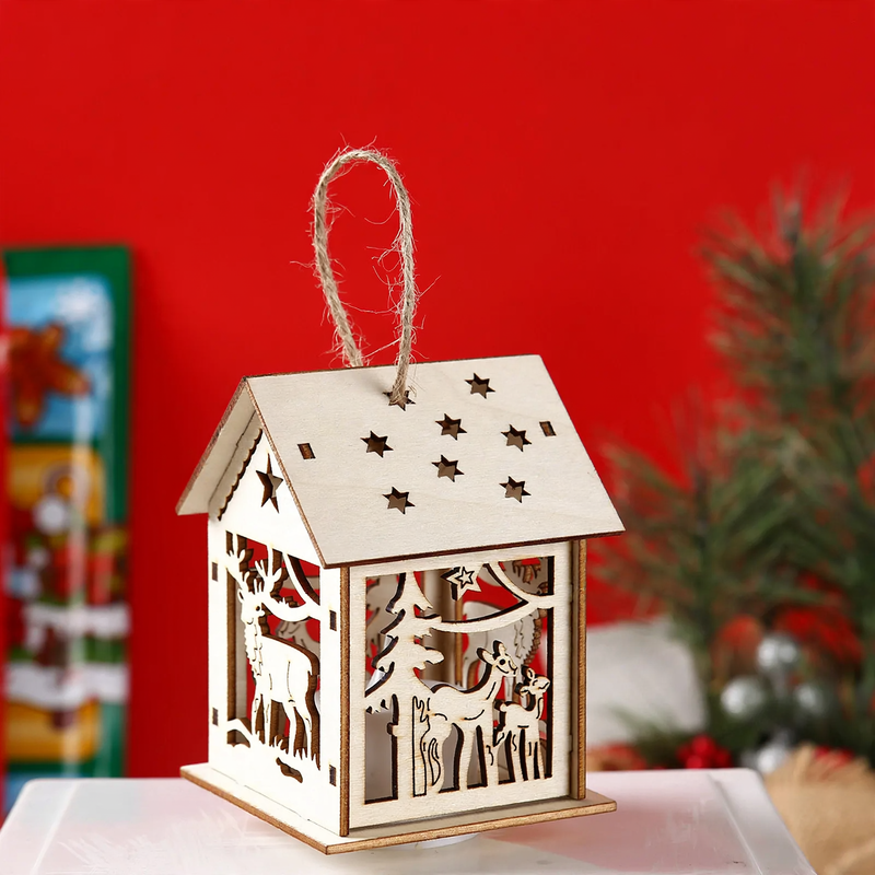 Illuminated wooden house as Christmas decoration
