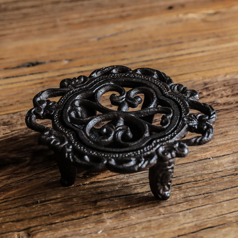 Cast iron teapot warmer with burner stand