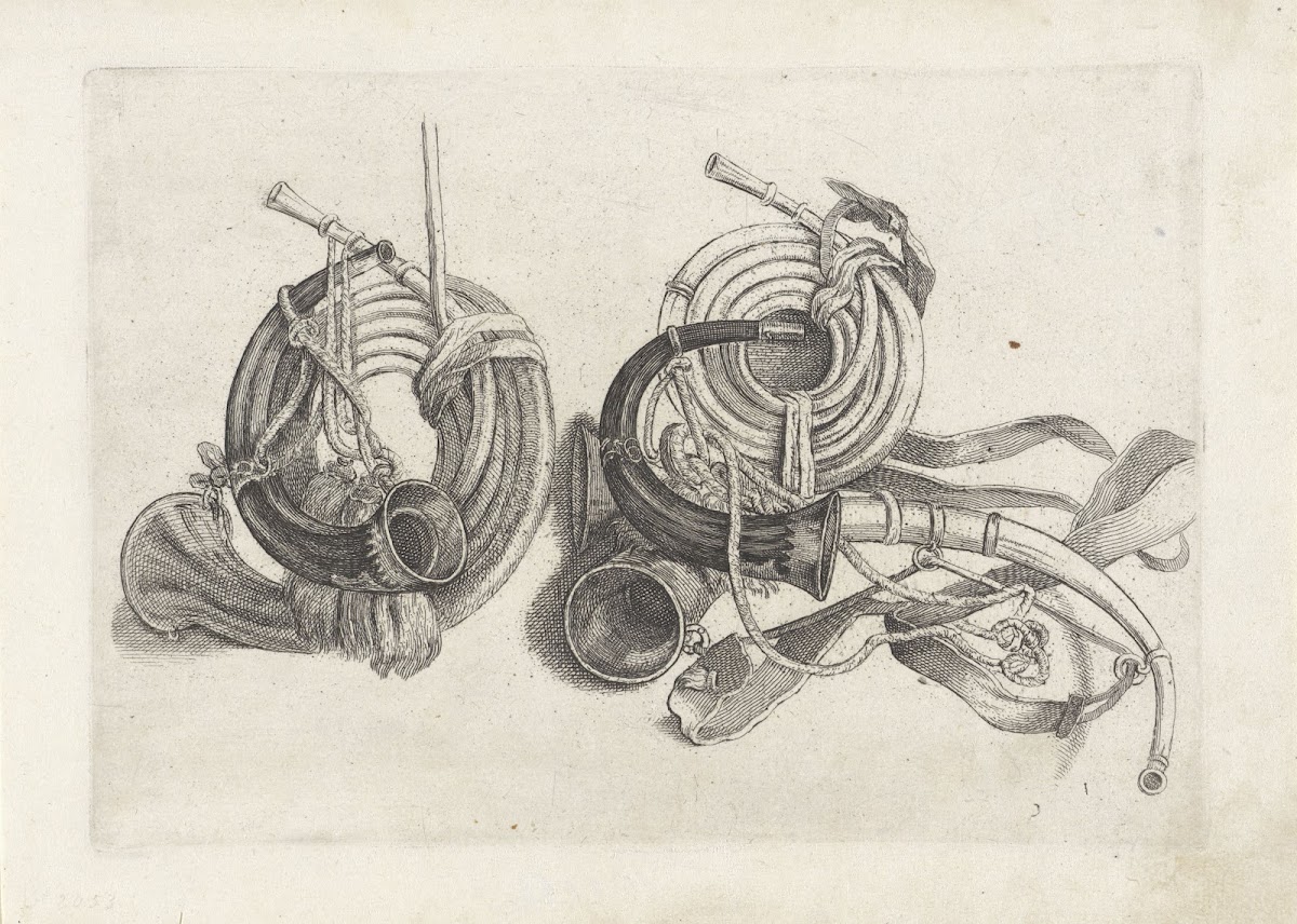 Five hunting horns of various shapes with cords and straps attached two at left