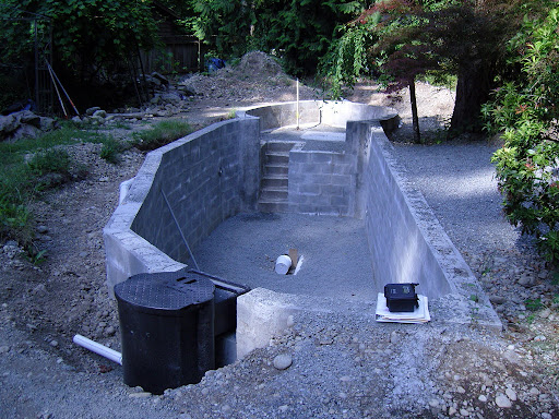 Block-built pond shell under construction before waterproofing