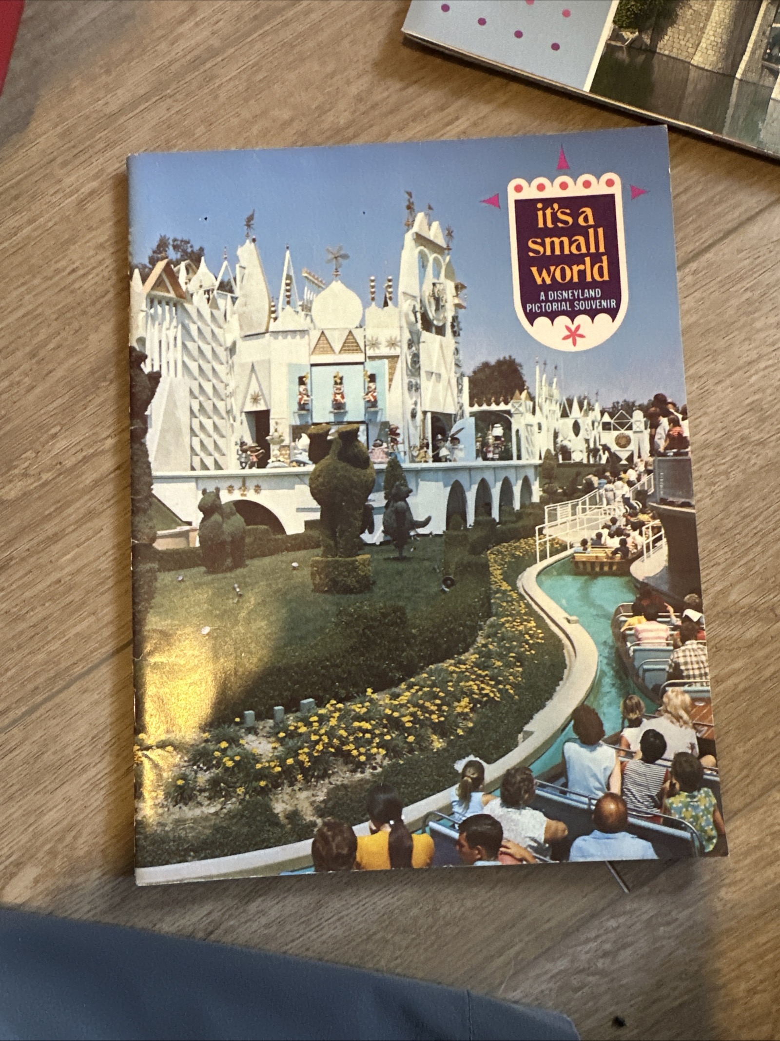 It's a Small World Disneyland pictorial souvenir program, 11 by 8.5 inches, showing the attraction exterior with period logo, late 1960s to early 1970s