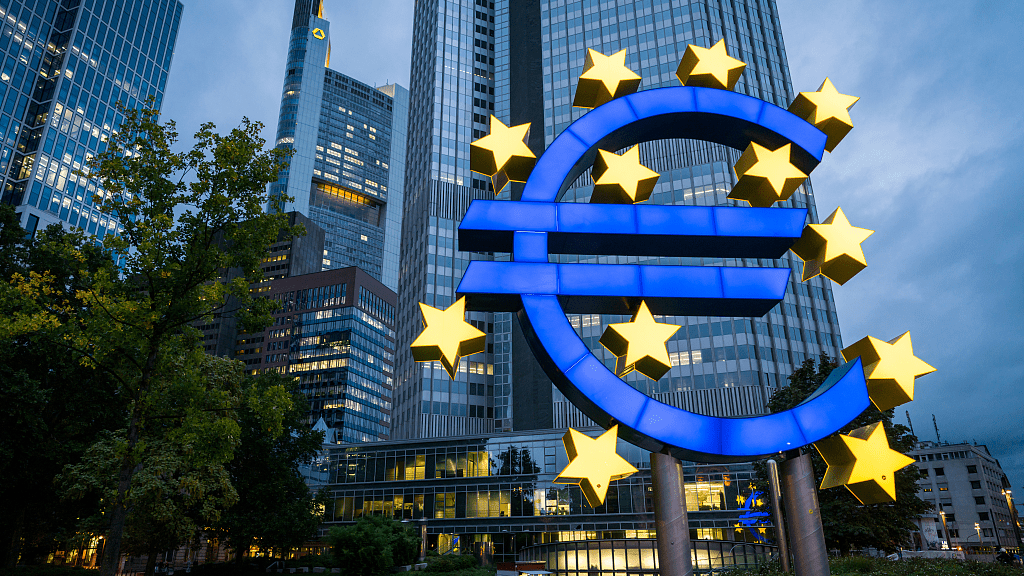 ECB Logo in front of ECB Building during a dark cloudy sky