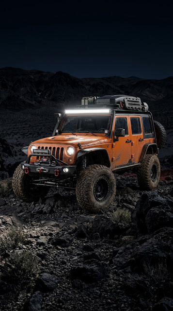 Rugged Orange Off-Road Vehicle in Desert Terrain at Night - Free mobile Wallpaper