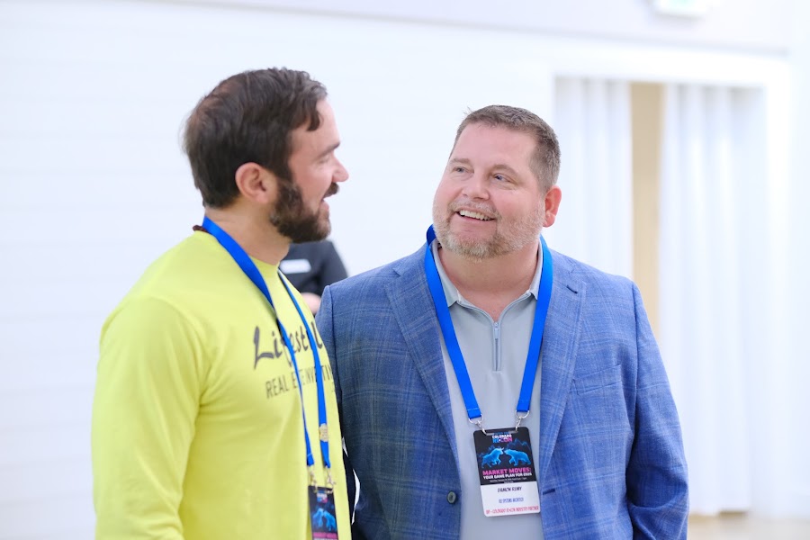 Attendees sharing a laugh at Colorado RE•CON