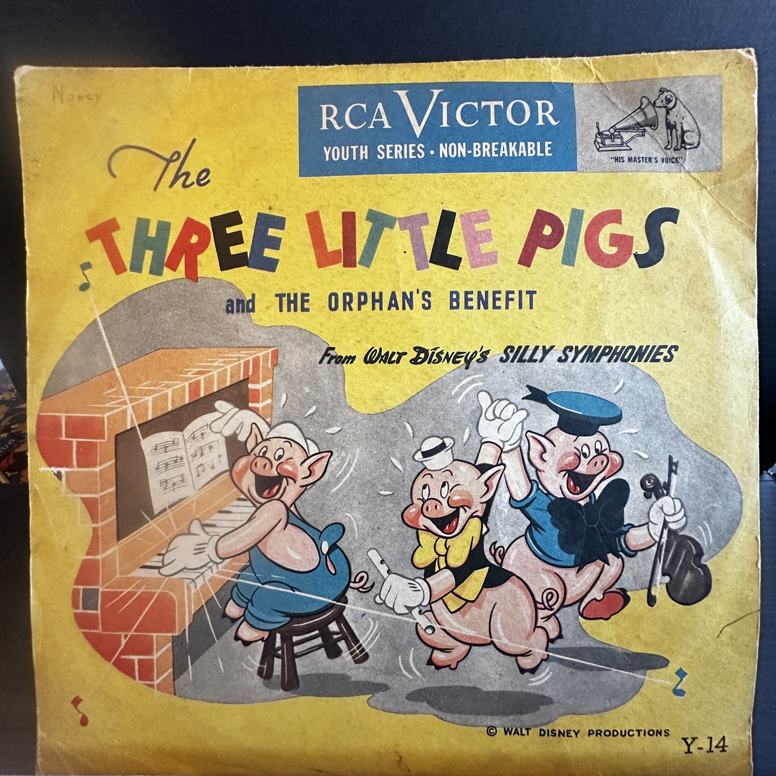 Vintage Disney Silly Symphonies record sleeve featuring Three Little Pigs and Orphan's Benefit, approximately 7 to 10 inches square, showing age-appropriate wear