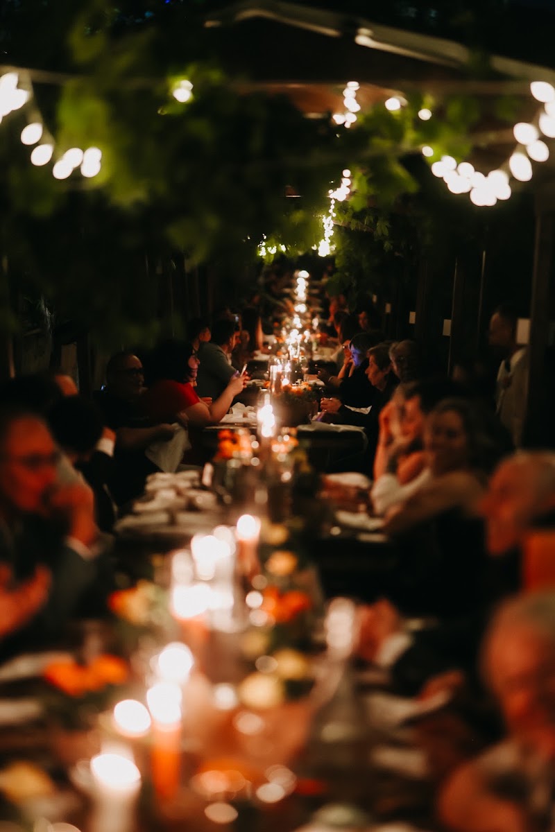 Candlelit wedding dinner at night among the Vesuvian vines