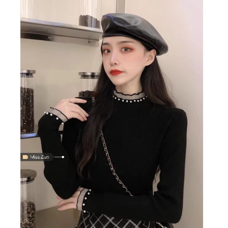 Women's knitted sweater with stand-up collar, lace, and pearls