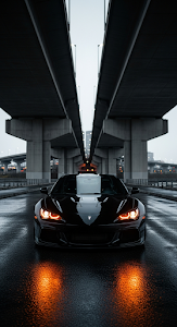 Aggressive Black Sports Coupe with Halo Lights Parked Under Dark Urban Bridge at Night