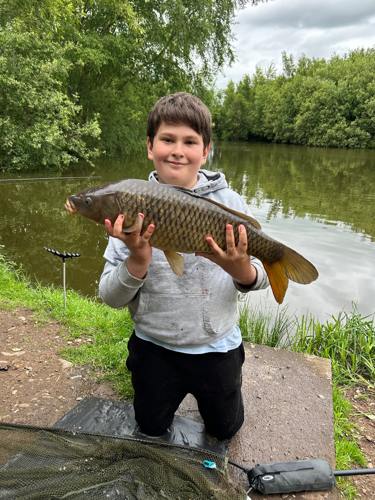 Jamie Burton with a Common Carp caught at Broom Fisheries