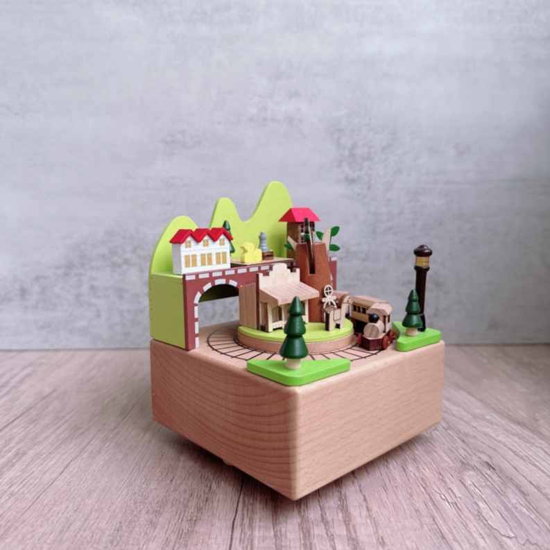 Manual music box made of beech wood with train motif