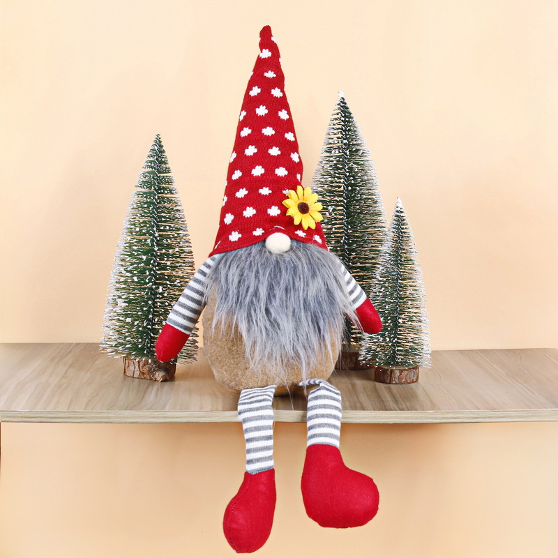 Christmas gnome figure with long legs, sitting