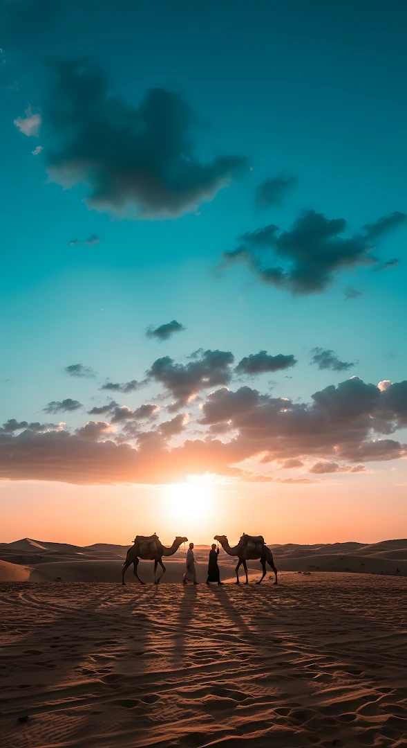 Desert Sunset Silhouette with Camels and Travelers