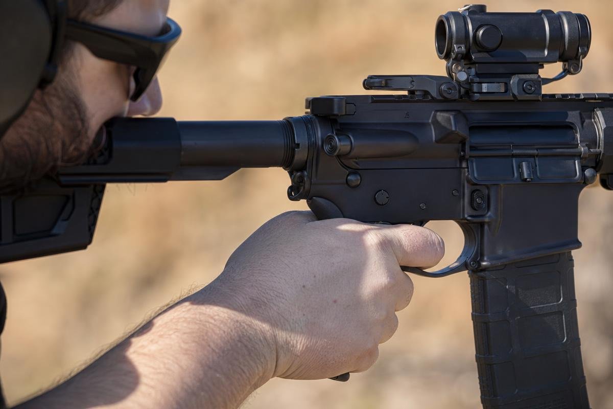 shooter demonstrating correct AR-15 grip angle on a carbine pistol grip