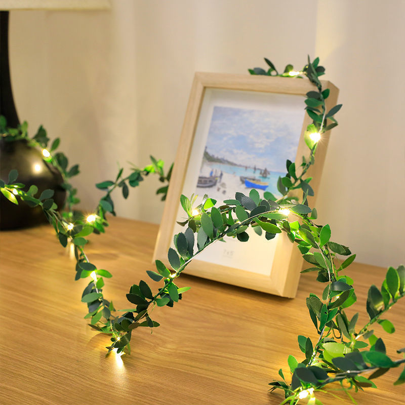 LED string lights with artificial plant vines