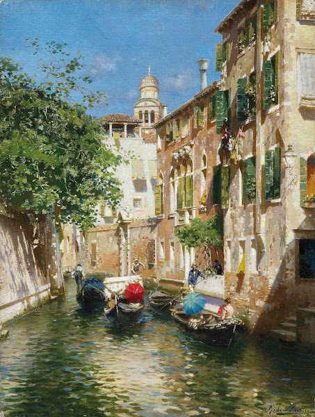 Gondoliers on a Venetian canal