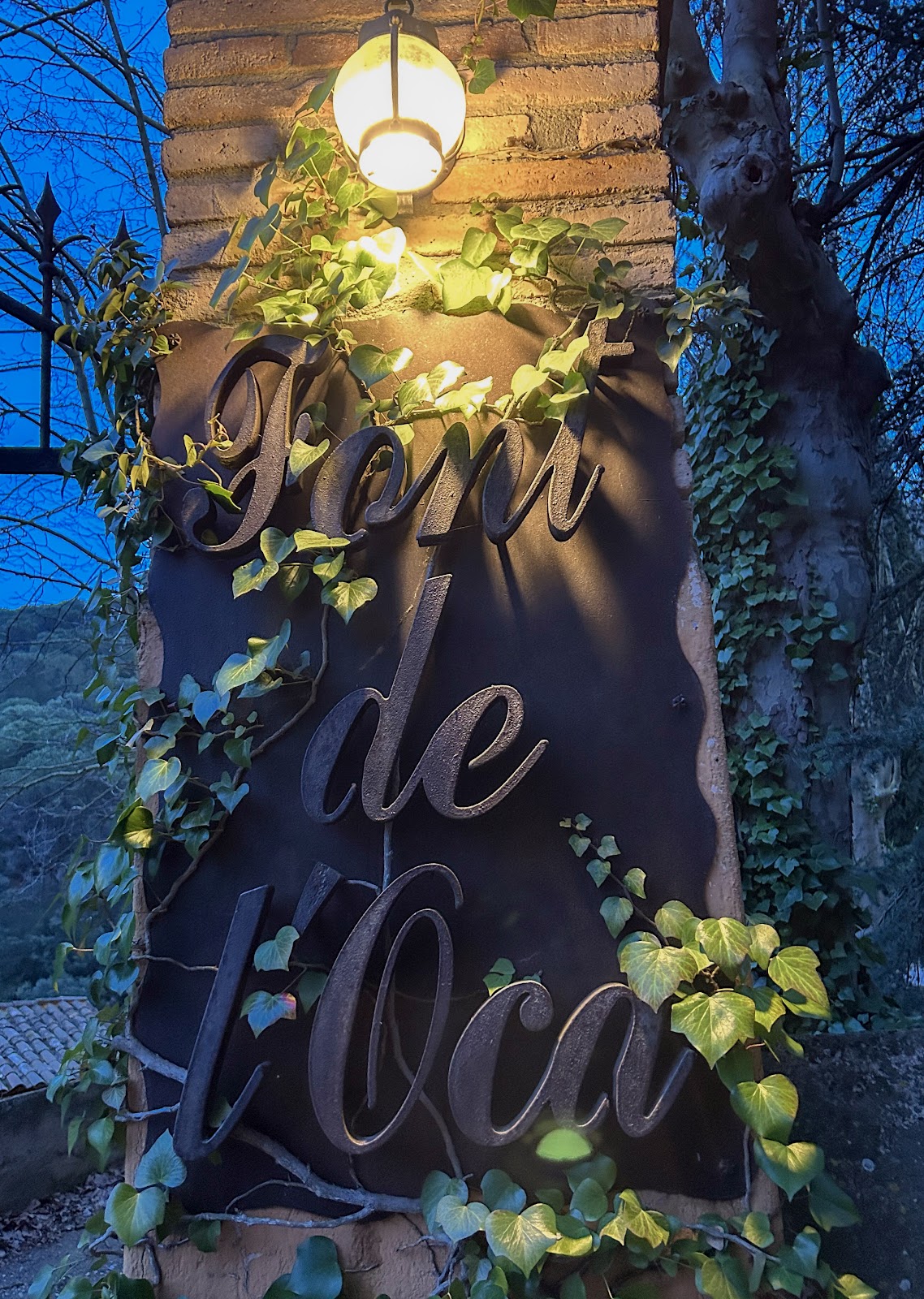 Font de l'Oca wellness retreat entrance at night — L'Espluga de Francolí, Catalonia