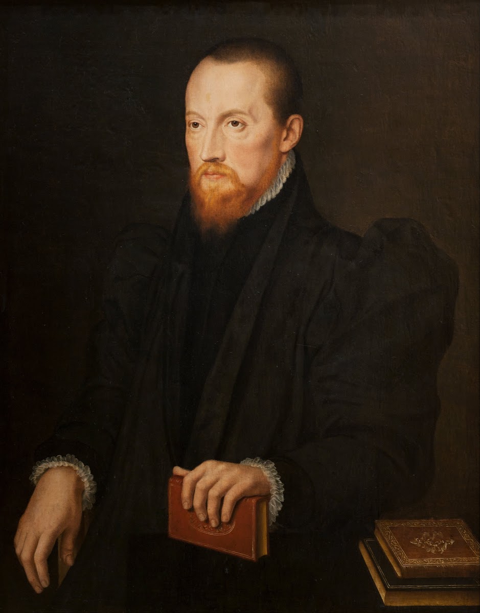 Bearded red headed Man seated