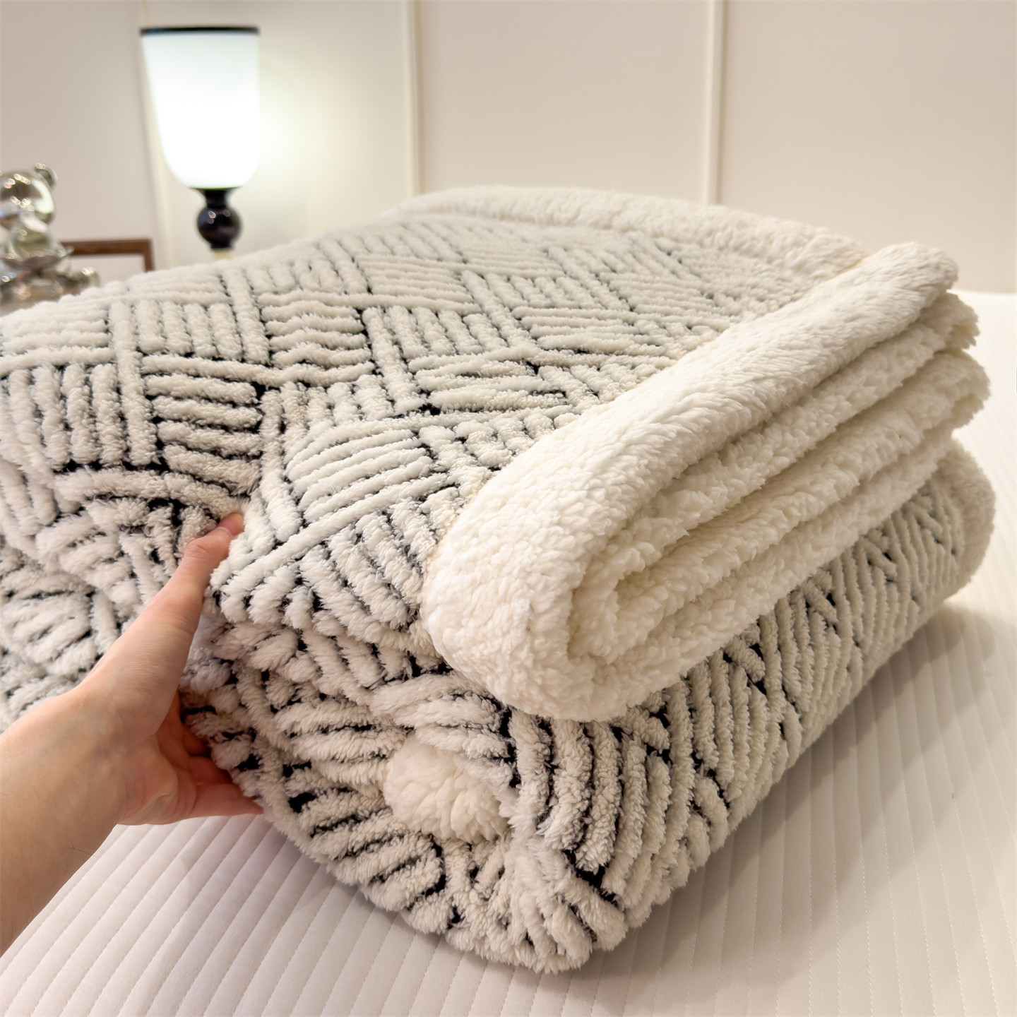 Patterned cozy blanket with lamb fleece look