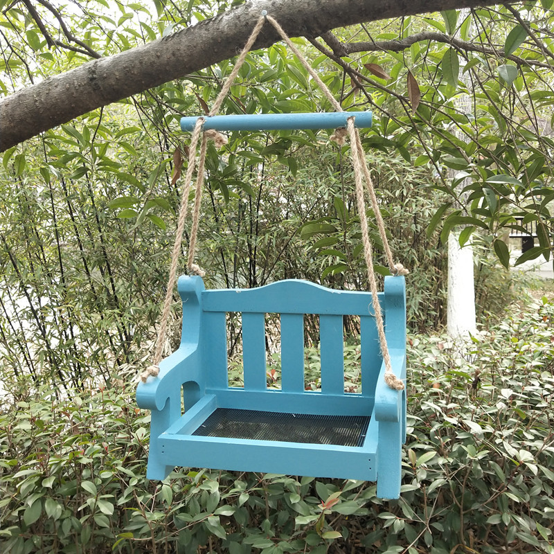 Automatic birdhouse made of pine wood to hang