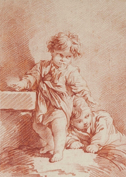 Deux jeunes garçons dont un allongé