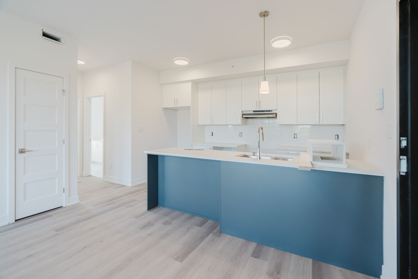 New kitchen with island in a Castle Heights, Ottawa residence