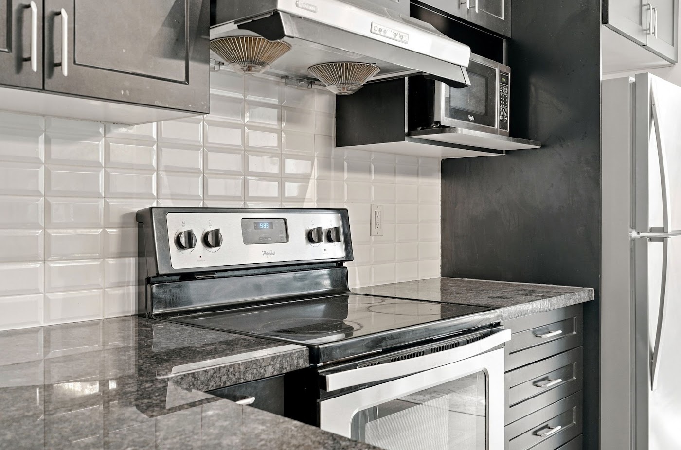 Subway tile backsplash, stainless range and hood