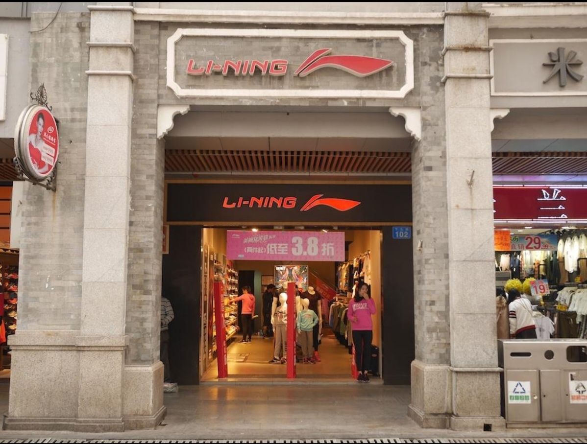 Interior atrium of a major Tianhe shopping mall with sportswear retail stores