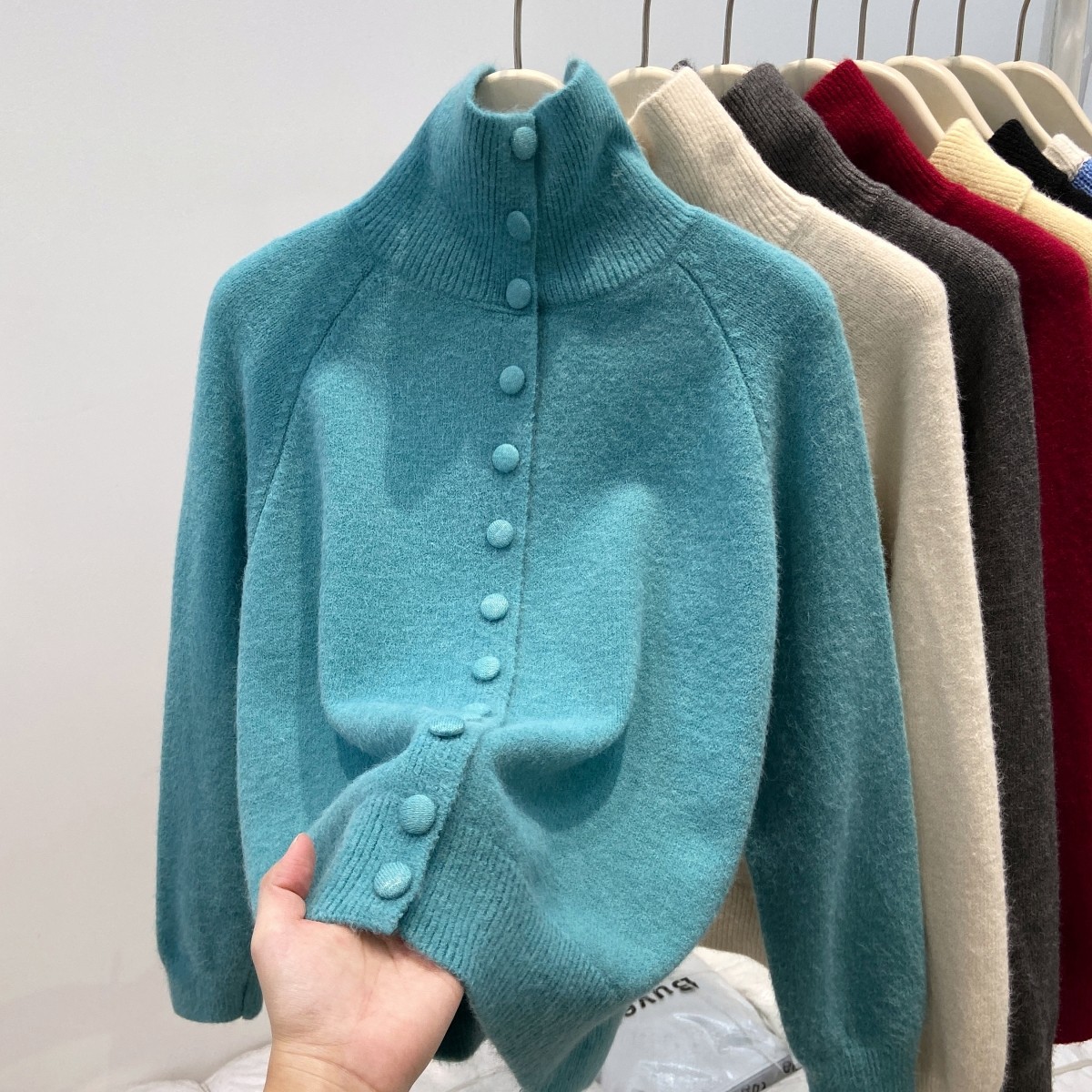 Women's cardigan with stand collar and button placket