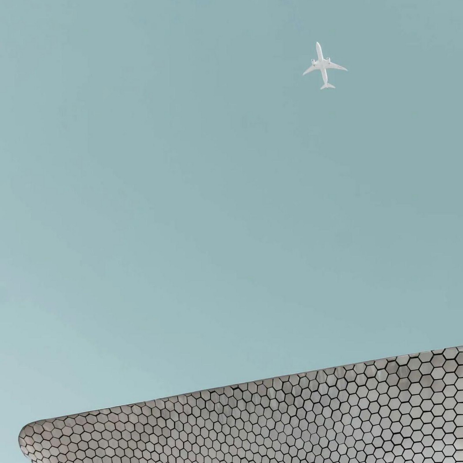 Download Airplane Flying Over Museo Soumaya Full HD iPhone