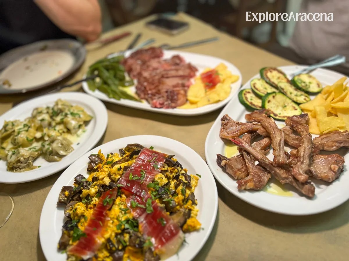 Shared dishes at Brioso Restaurante, including a vegetable-and-egg revuelto, creamy artichokes, jamón and grilled meat served with courgette.