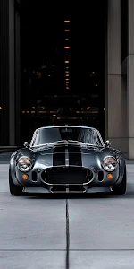 Classic Shelby Cobra Sports Car in Urban Garage Setting
