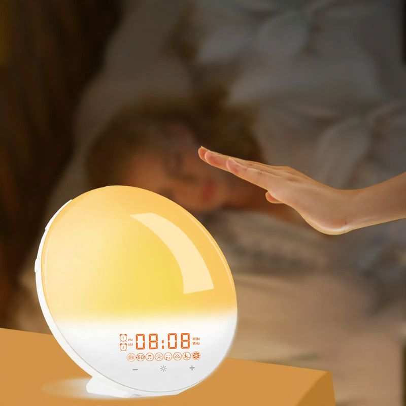 Alarm clock with light, FM radio, and sunrise simulation
