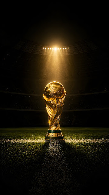 Gold Football Trophy Under Stadium Spotlight Wallpaper - Free mobile Wallpaper