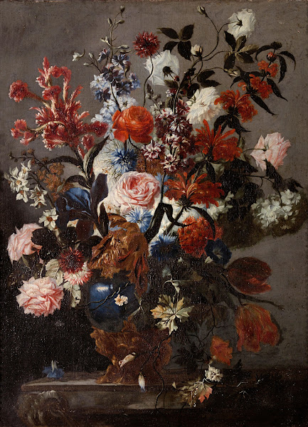 A still life of roses tulips and other flowers in a vase