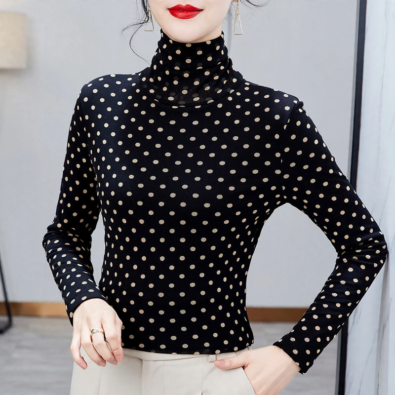 Women’s top with stand-up collar and polka dot pattern
