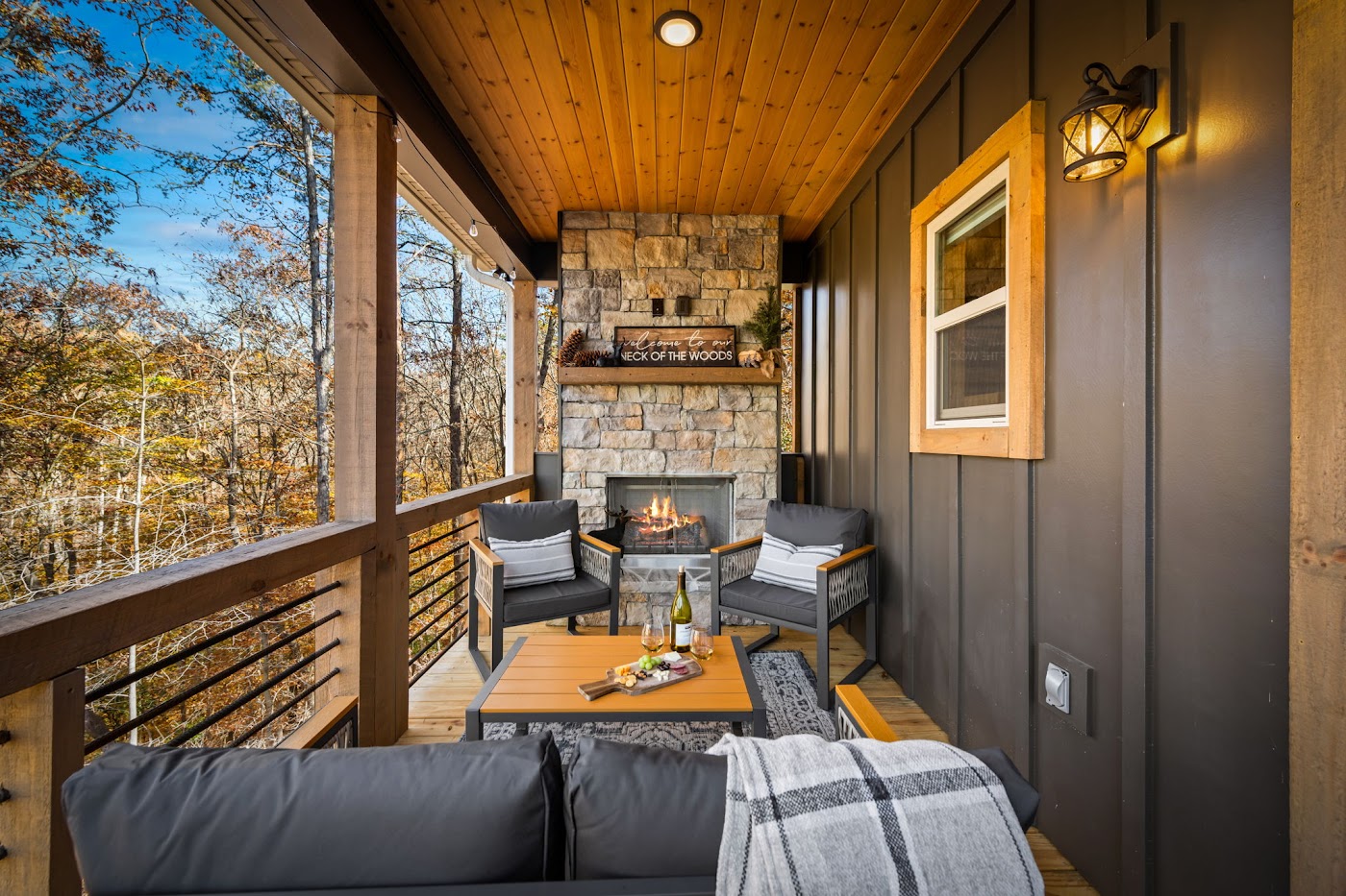 Back deck outdoor fireplace at Orchard & Vine Mountain Haus, Ellijay, Georgia
