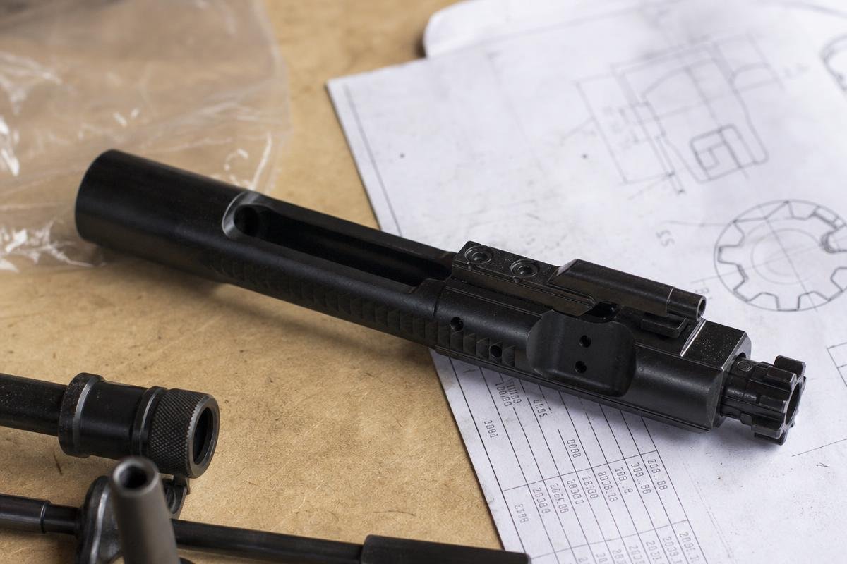 Carpenter 158 BCG showing mil-spec bolt carrier group steel markings